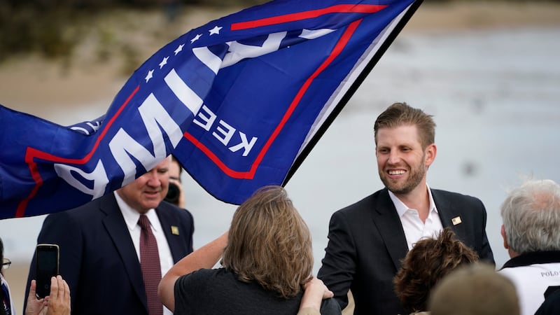 Eric Trump, the son of President Donald Trump, greets supporters at a campaign rally, Tuesday,...
