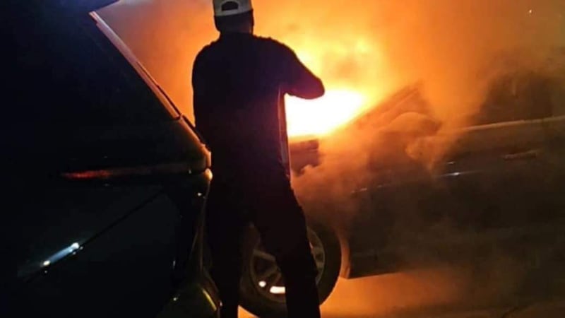 Multiple Columbus High school football coaches helped contain a car fire at an away game in...