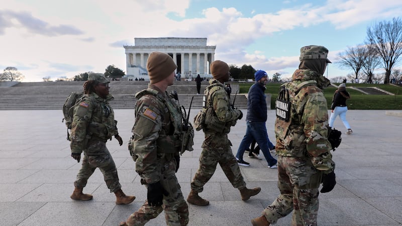 National Guard patrol the National Mall near the Lincoln Memorial, Friday, Nov. 28, 2025, in...