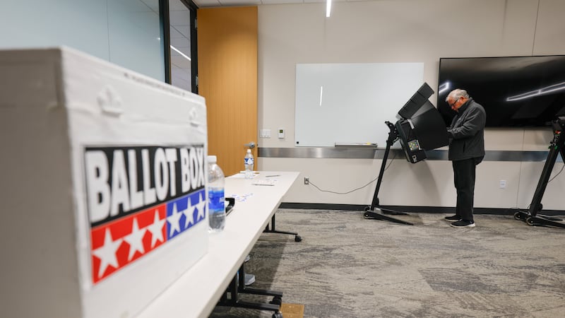 A voter casts a ballot during early voting in Waukesha, Wis., Tuesday, March 18, 2025. (AP...