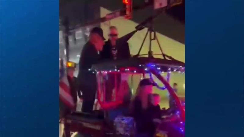 A Halloween parade received backlash over a float depicting Trump leading Harris in chains.