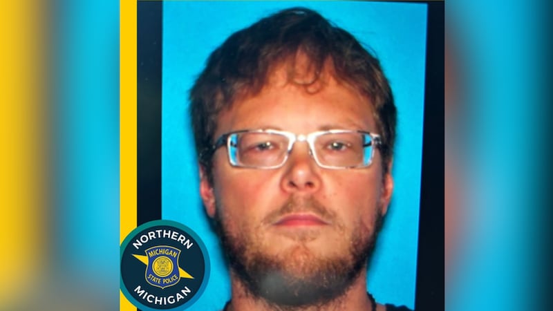 Suspect Chad Hickman is shown in an undated poster provided by the Michigan State Police.